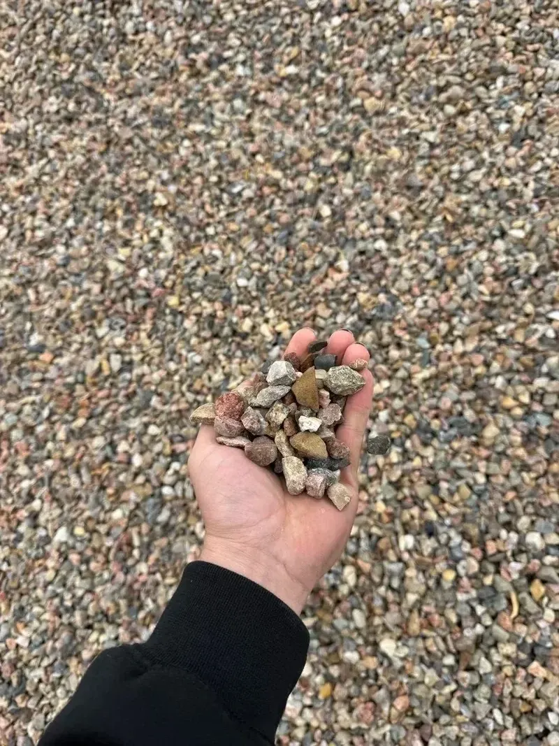 Crushed aggregate base material for compacted gravel delivery