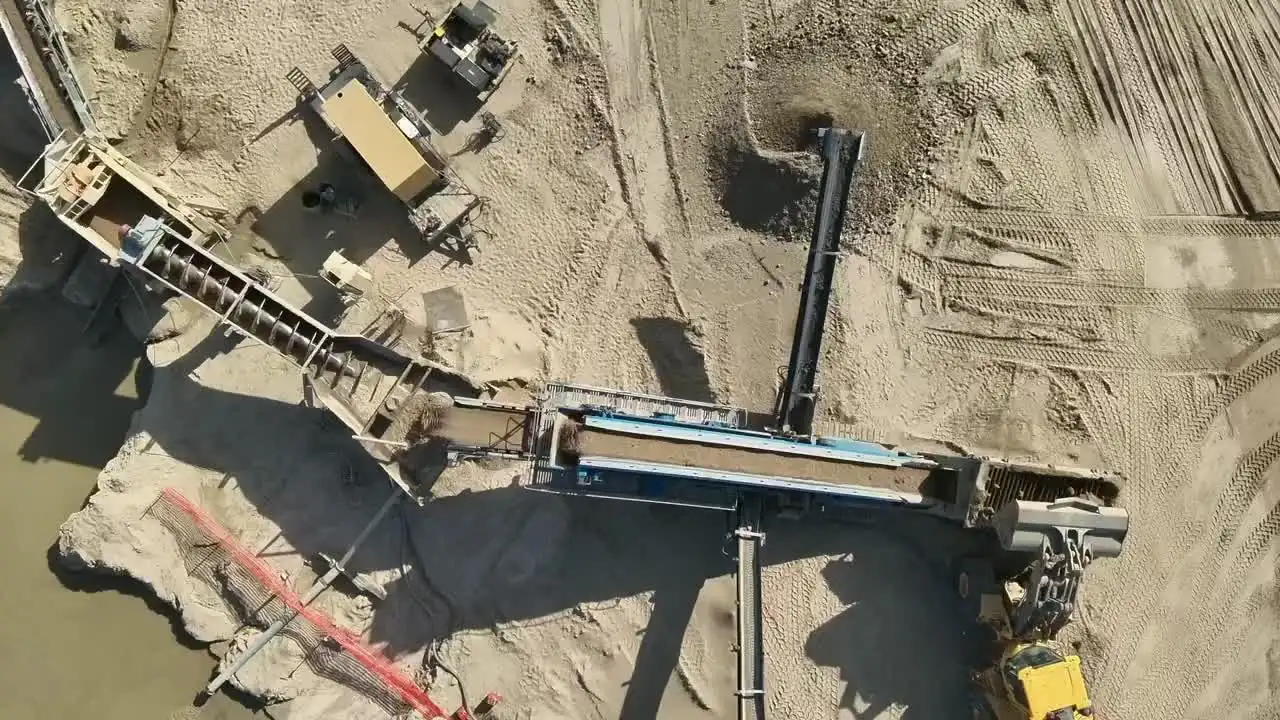 Top-down aerial view of an active aggregate processing site